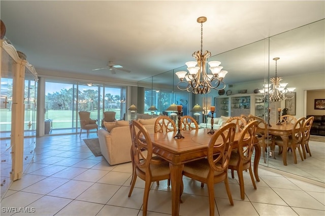 725 Saratoga Cir Unit A103, Naples, FL 34104 - dining room with light tile patterned floors and ceiling fan with notable chandelier