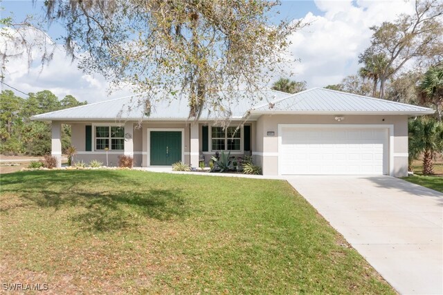 single story home featuring a garage and a front yard