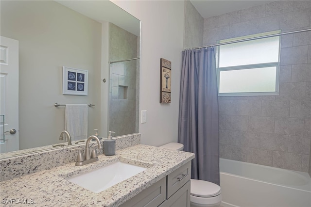 full bathroom with vanity, toilet, and shower / bath combo with shower curtain