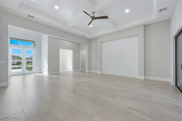 unfurnished living room with visible vents, baseboards, coffered ceiling, and beamed ceiling