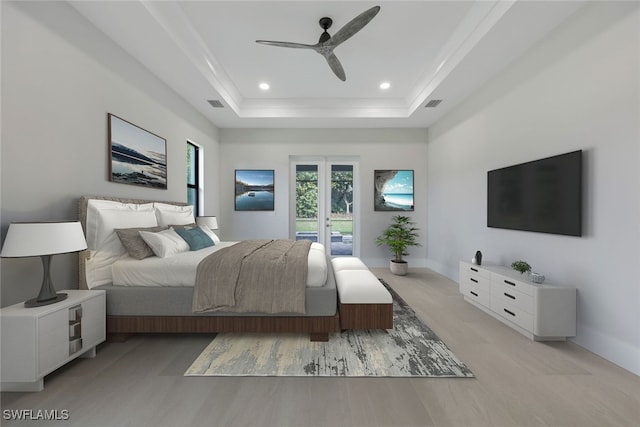 bedroom with access to exterior, french doors, visible vents, recessed lighting, and a tray ceiling