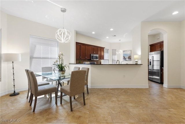 dining space with a chandelier