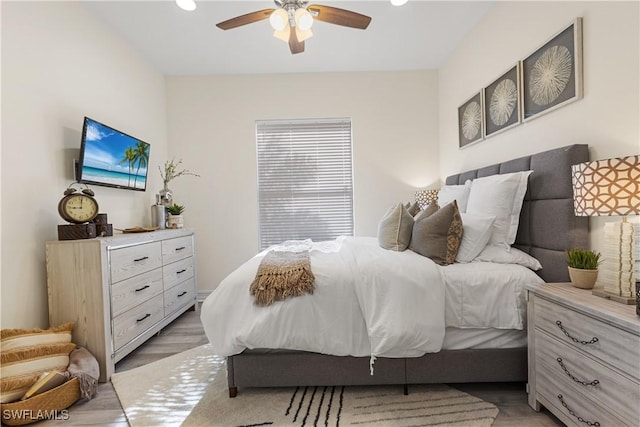 bedroom featuring ceiling fan and light wood-type flooring