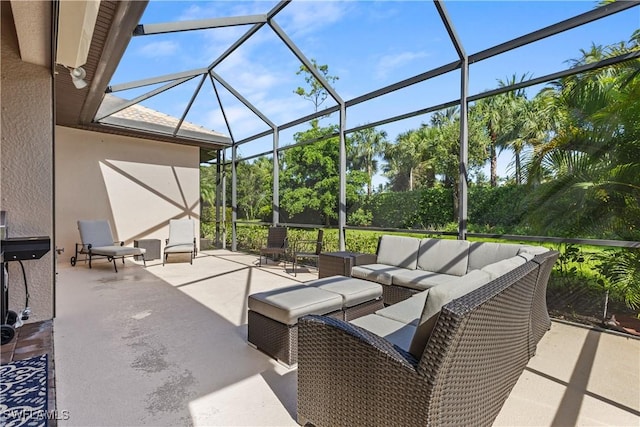 view of patio / terrace featuring an outdoor living space and a lanai