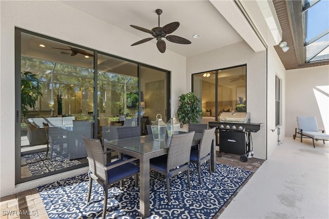 view of patio featuring ceiling fan and grilling area