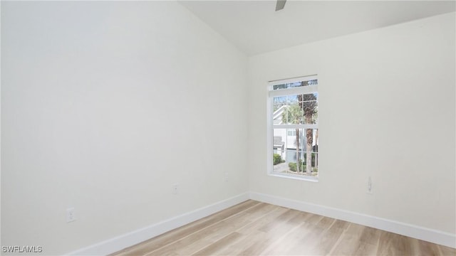 empty room featuring light wood-style flooring and baseboards