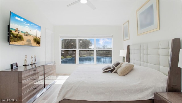 bedroom featuring a water view