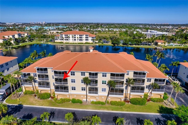 birds eye view of property with a water view