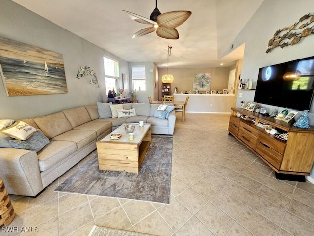 tiled living room featuring ceiling fan