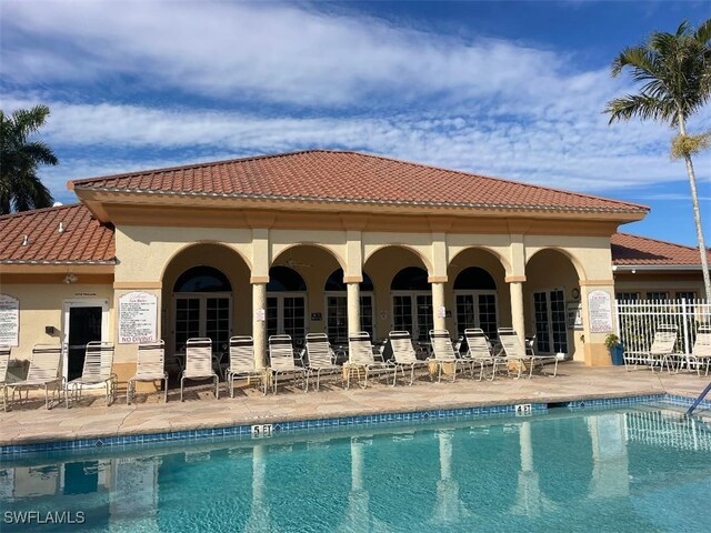 15495 Bellamar Cir Unit 2222, Fort Myers, FL 33908 - community pool with a patio area
