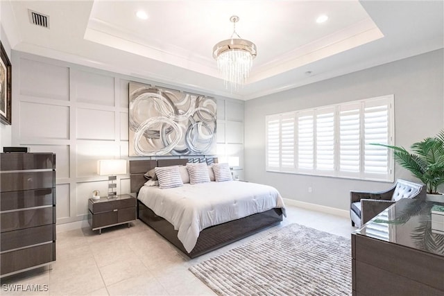 bedroom with a raised ceiling, ornamental molding, light tile patterned flooring, and an inviting chandelier