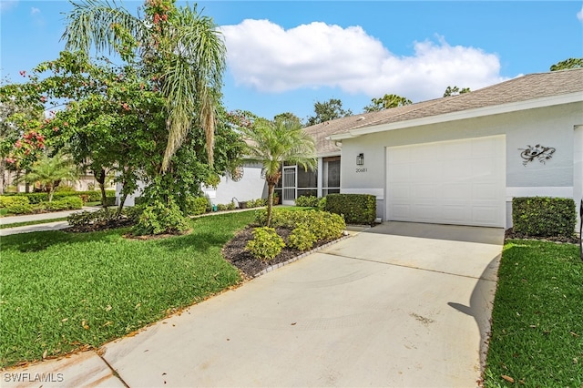 single story home with a garage and a front yard