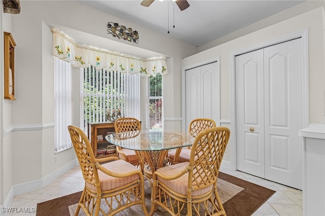 dining room featuring light tile patterned floors and ceiling fan