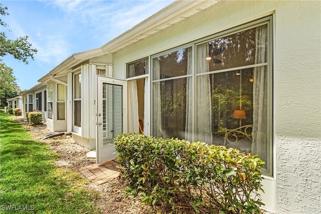 view of side of property featuring a yard