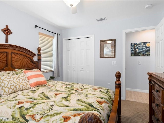 bedroom featuring ceiling fan and a closet