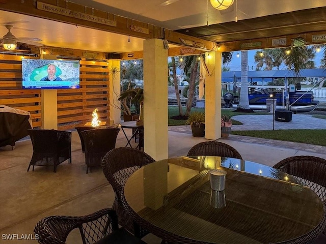 view of patio terrace at dusk