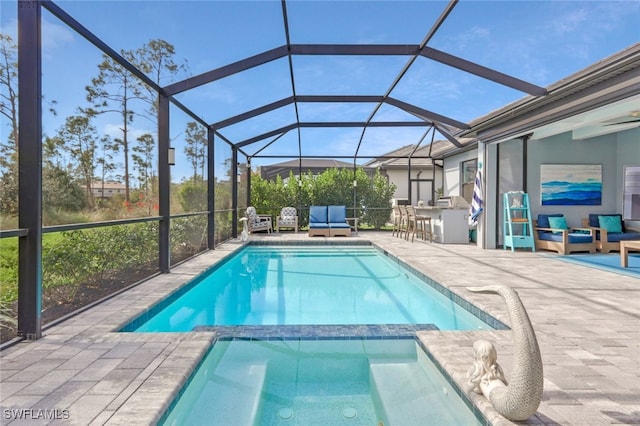 view of pool featuring a patio, an outdoor living space, an outdoor bar, and glass enclosure