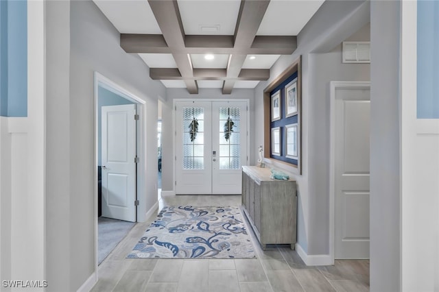 entrance foyer with french doors, visible vents, coffered ceiling, beamed ceiling, and baseboards