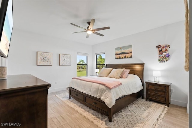 bedroom featuring ceiling fan and light hardwood / wood-style floors