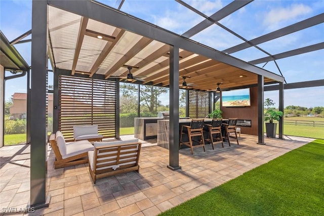 view of patio featuring an outdoor living space, a pergola, ceiling fan, and exterior bar