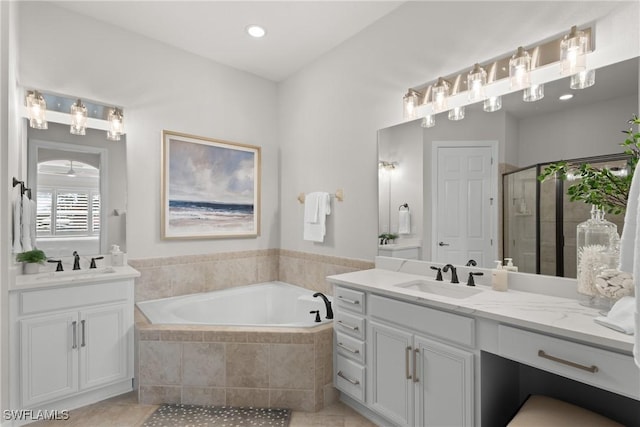 bathroom featuring vanity, plus walk in shower, and tile patterned flooring