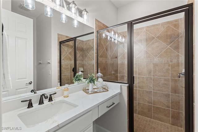 bathroom with vanity and walk in shower