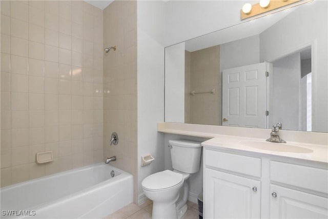 bathroom with toilet, bathing tub / shower combination, vanity, and tile patterned floors