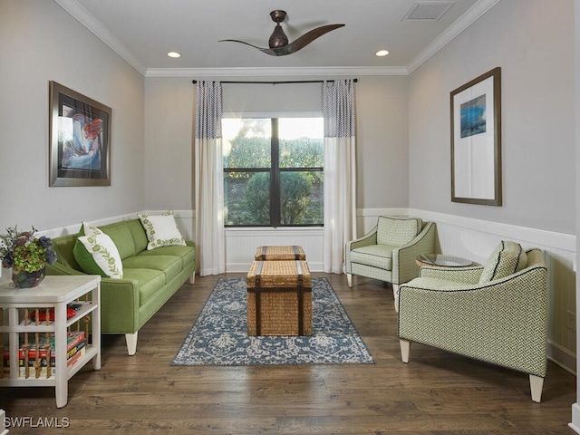 living room with ornamental molding, dark hardwood / wood-style floors, and ceiling fan