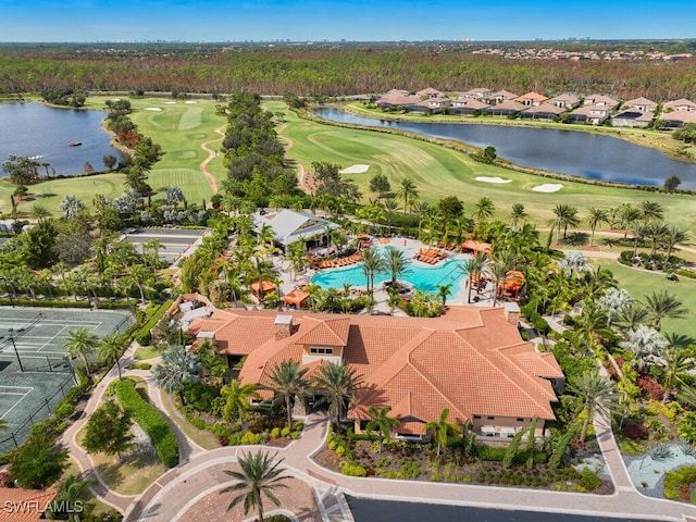 birds eye view of property with a water view, view of golf course, and a residential view