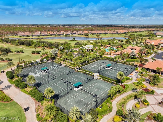 bird's eye view featuring a water view and a residential view