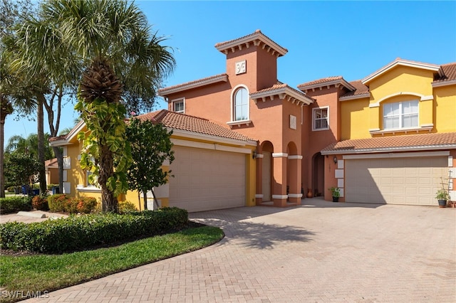 mediterranean / spanish house featuring a garage