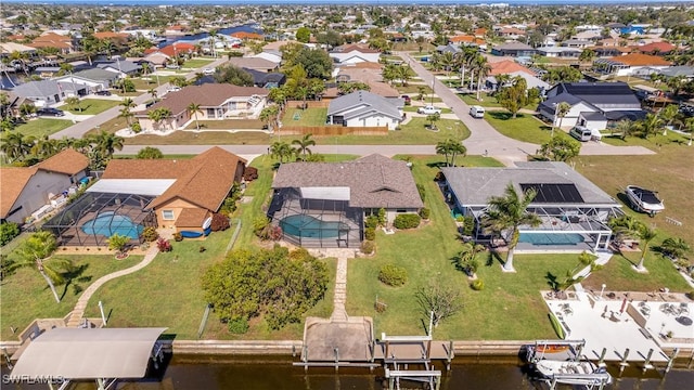 aerial view with a residential view and a water view