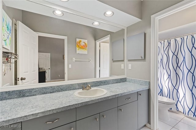 bathroom with tile patterned floors, vanity, toilet, and recessed lighting