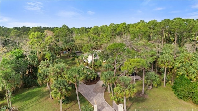 drone / aerial view featuring a view of trees