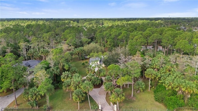 drone / aerial view with a view of trees