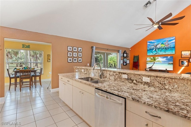 kitchen featuring light tile patterned floors, visible vents, light stone countertops, stainless steel dishwasher, and a sink