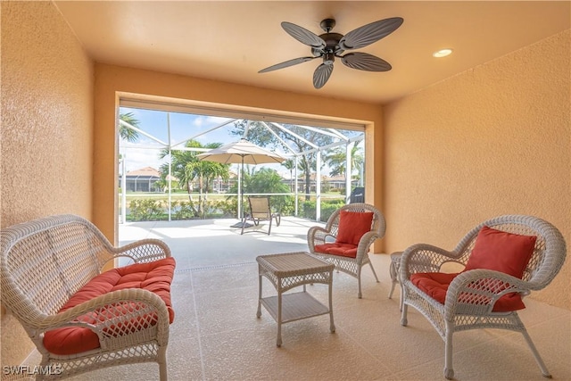 view of patio / terrace featuring a lanai, an outdoor hangout area, and ceiling fan