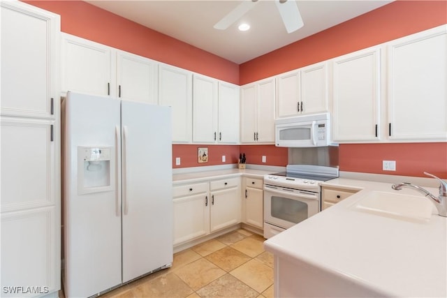 kitchen featuring white appliances, sink, and white cabinets