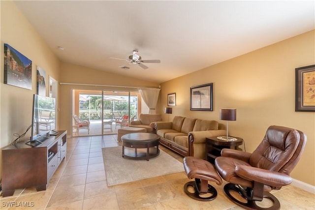 tiled living room with ceiling fan and lofted ceiling