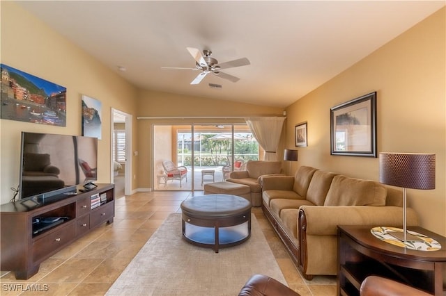 tiled living room featuring ceiling fan and lofted ceiling