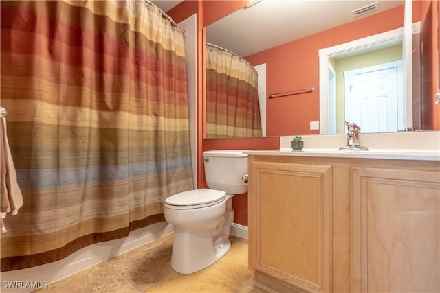 bathroom with vanity, curtained shower, tile patterned floors, and toilet