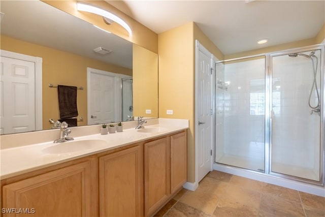 bathroom with vanity and an enclosed shower