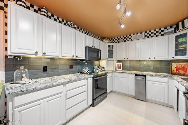 kitchen with white cabinetry, light stone countertops, backsplash, and electric range oven