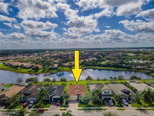 birds eye view of property with a water view