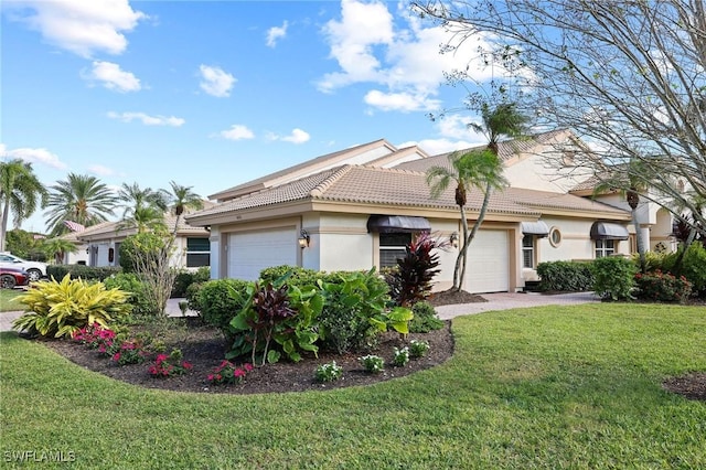 view of front of house featuring a garage and a front yard