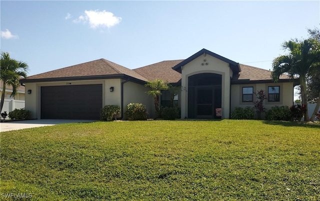 ranch-style home featuring a garage and a front yard