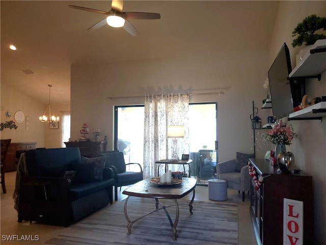 living room with ceiling fan with notable chandelier