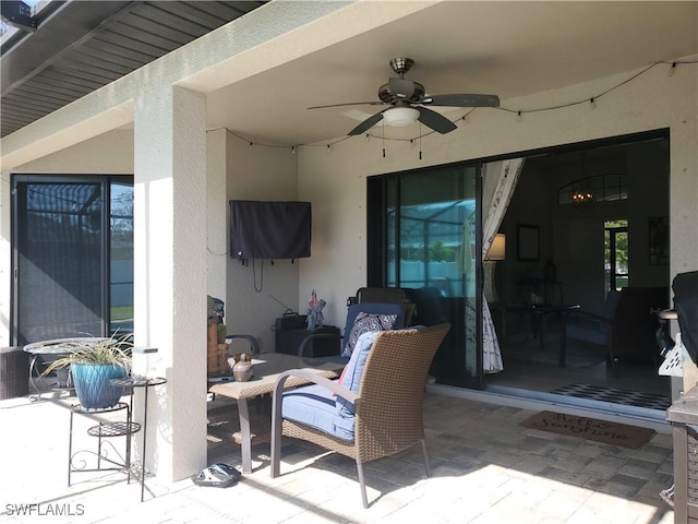 view of patio / terrace featuring ceiling fan