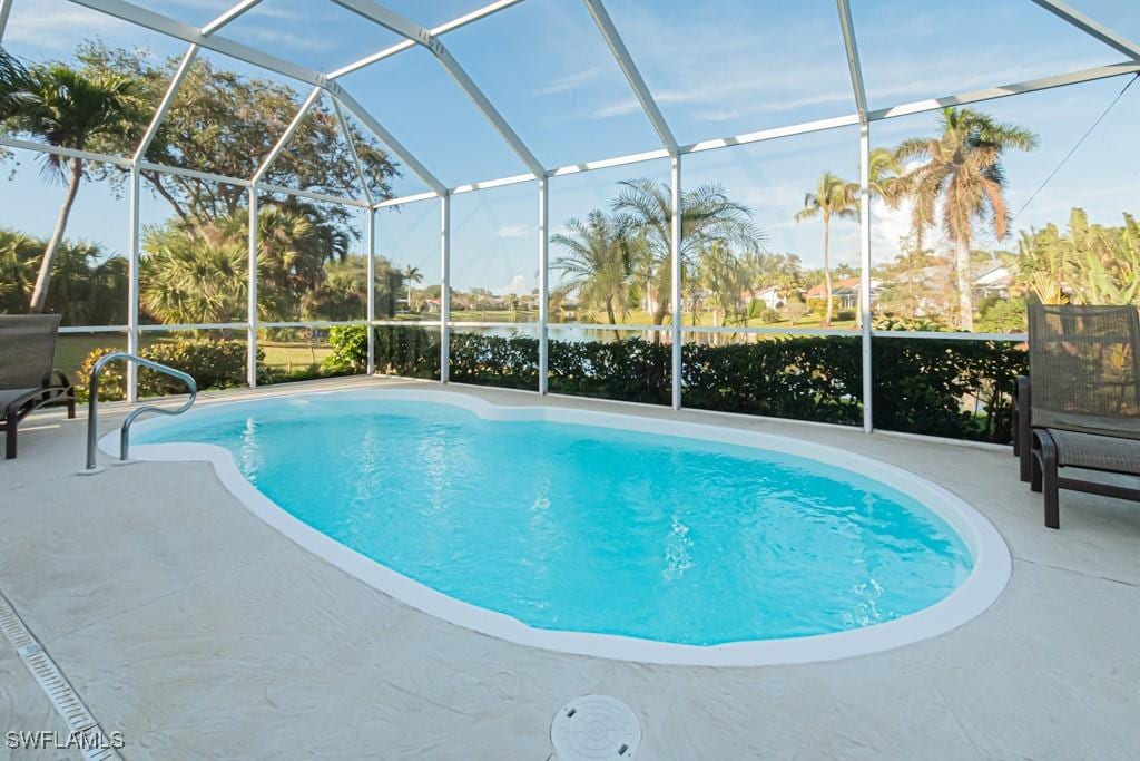 466 Briarwood Blvd, Naples, FL 34104 - view of swimming pool featuring a lanai and a patio