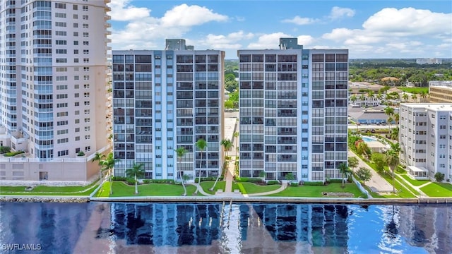 exterior space with a water view and a view of city